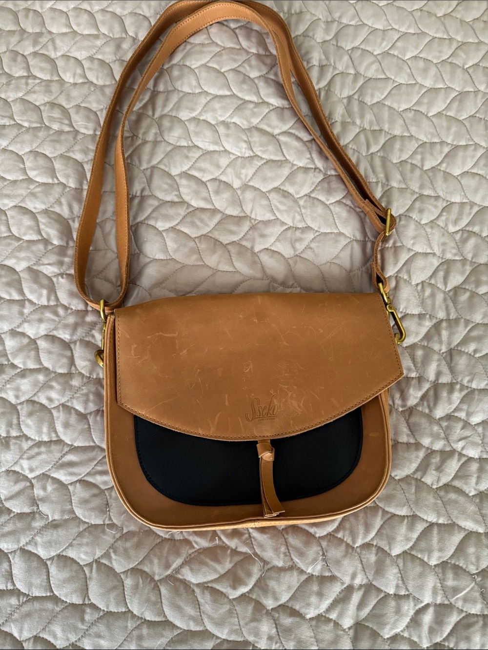 Sseko Tan and Black Two-Tone Leather Saddle Shoulder Bag